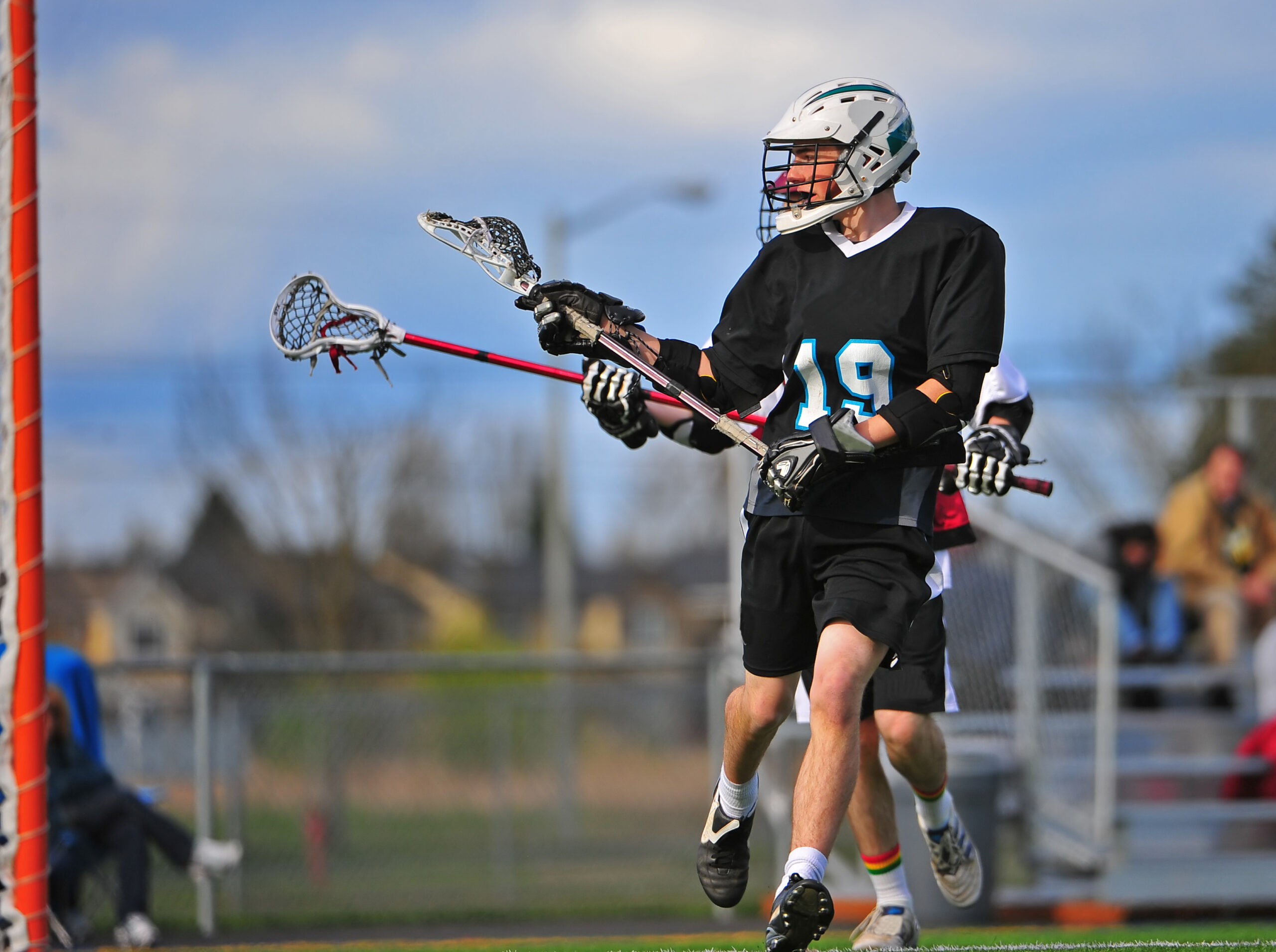 mens,lacrosse,player,taking,a,shot,on,the,goal,with mens,lacrosse,player,taking,a,shot,on,the,goal,with